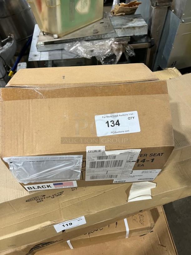 BRAND NEW Carlisle 7114 black polypropylene dual-sided booster seat with safety strap in original packaging.