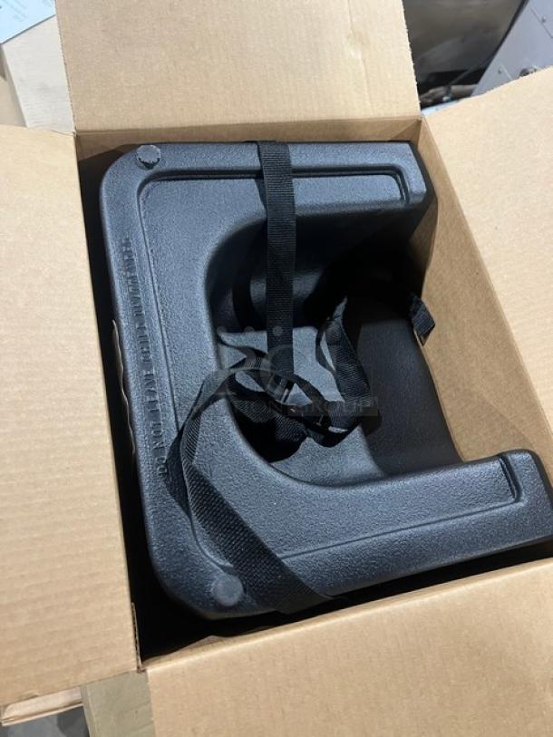 Brand new Carlisle 7114 black polypropylene dual-sided booster seat with safety strap in box.