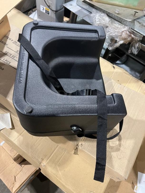 Carlisle 7114 dual-sided black polypropylene booster seat, brand new, with safety strap.