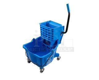 Brand new Carlisle 26 Qt. blue mop bucket with side press wringer, model 3690814, on casters.