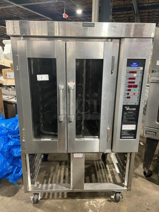 Baxter OV300G stainless steel convection oven with digital controls, 8-pan rotating rack, and equipment stand on casters.