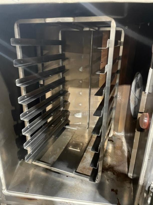 Baxter OV300G stainless steel convection oven, interior 8-pan rotating rack, digital control, mounted on casters.