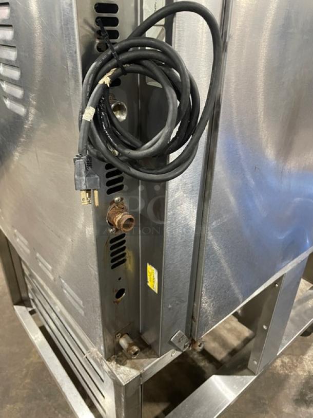 Baxter OV300G stainless steel convection oven, natural gas powered, 8-pan rotating rack, digital controls, on casters.