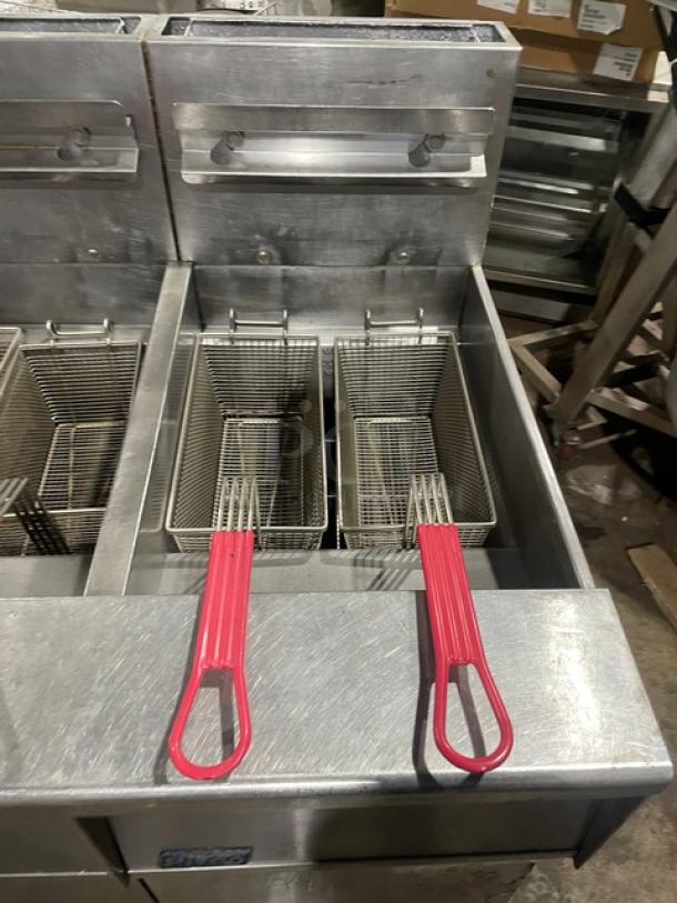 Pitco FGSGH50 commercial 4-bay deep fryer; stainless steel; natural gas; includes basket hangers, fry baskets, oil filter; good condition.