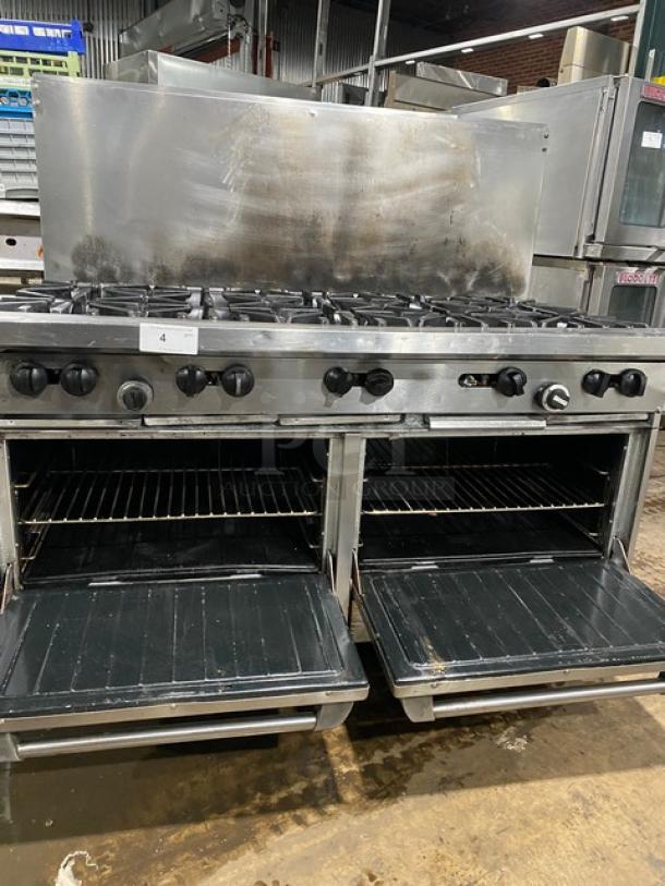 Garland stainless steel 10-burner range with double ovens, backsplash, wired racks, on legs; natural gas powered.