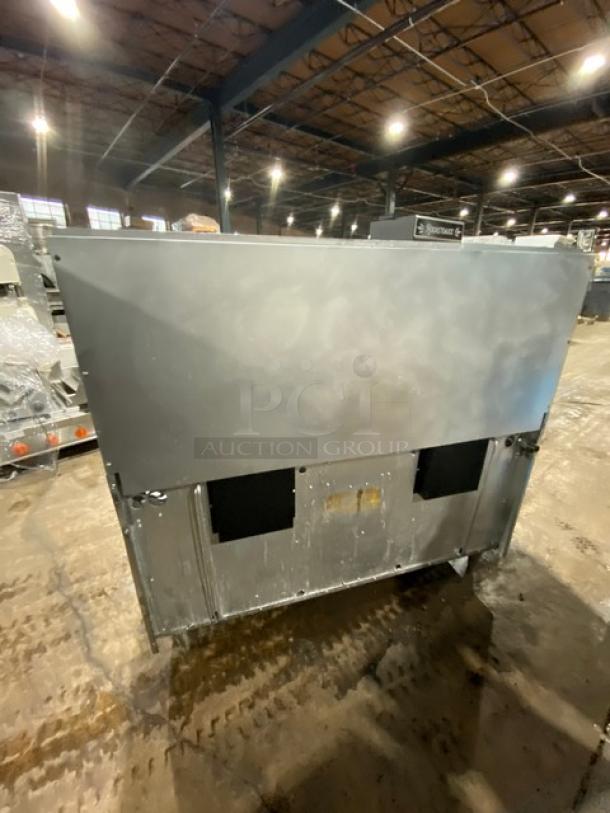 Garland stainless steel 10 burner range with double oven, backsplash, wired oven rack, on legs, natural gas powered.