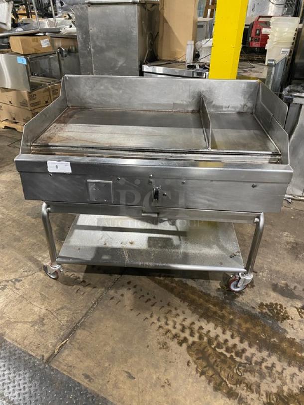 WoodStone stainless steel natural gas countertop plancha griddle with back and side splash, single undershelf cart on casters.