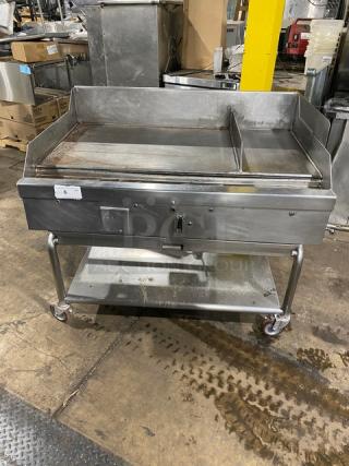 WoodStone stainless steel natural gas countertop plancha griddle with back and side splash, single undershelf cart on casters.