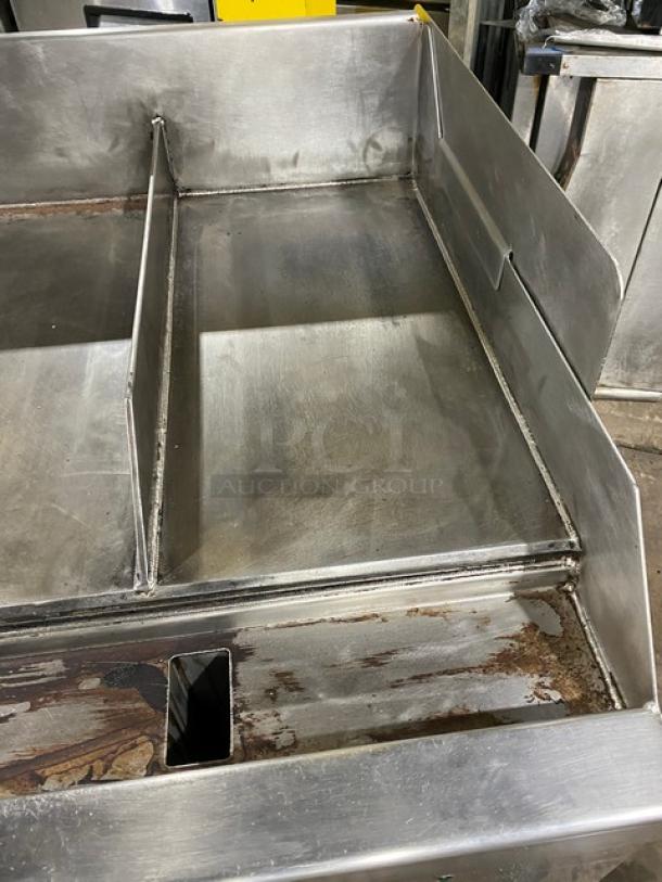 WoodStone stainless steel countertop plancha griddle with back and side splash, single undershelf cart, on casters, SN: GP1B16MAY1704992.