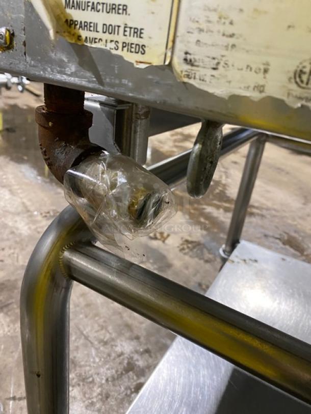 WoodStone stainless steel natural gas plancha griddle on casters, with back and side splash, single undershelf equipment cart. SN: GP1B16MAY1704992.