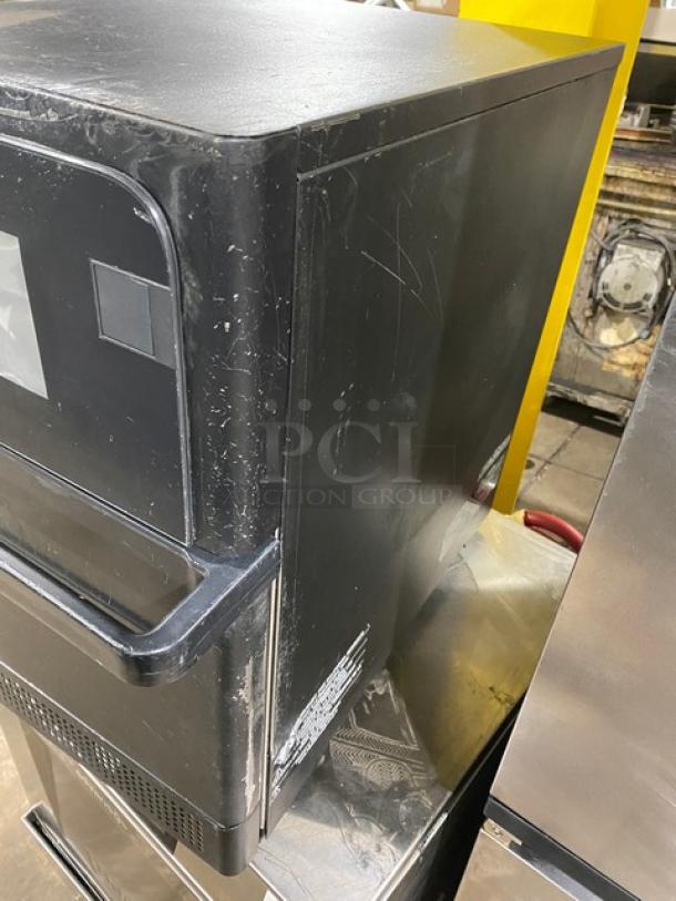 MerryChef Eikon E2S black electric countertop oven, 2022 model. Visible scratches on side; commercial rapid cook feature.