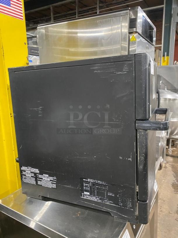 MerryChef Eikon E2S black electric countertop rapid cook oven, 2022 model, with visible wear, commercial-grade label details.