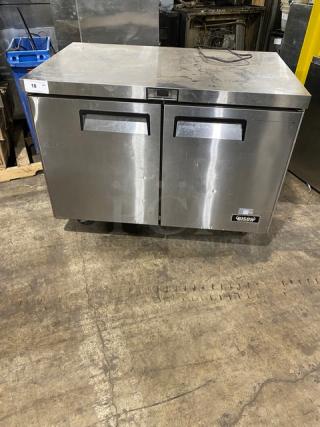 Bison BUR48 stainless steel 2-door undercounter worktop refrigerator on casters, 115V. Visible Bison logo and sturdy construction.