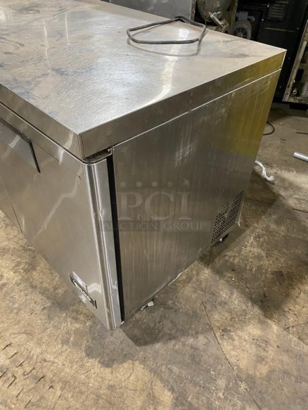 Bison Stainless Steel 2-Door Undercounter Refrigerator, Model BUR48, on casters, showing surface wear. 115V, 1 Phase.