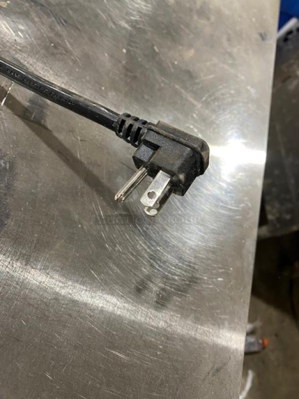 Power cord for Bison BUR48 stainless steel refrigerator, 115V 1 phase, shown on reflective metal surface.