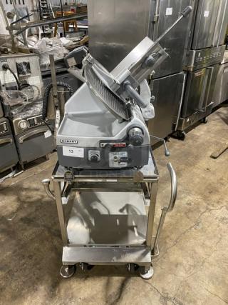 Hobart 2912 commercial meat slicer on new stainless steel stand, electric, 120V, 1 phase, excellent condition.