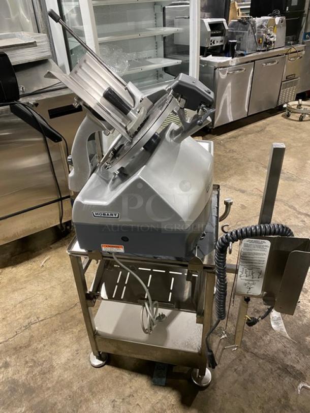Hobart Model 2912 commercial meat slicer on new stand, stainless steel, electric-powered, 120V, 1 Phase, excellent condition.