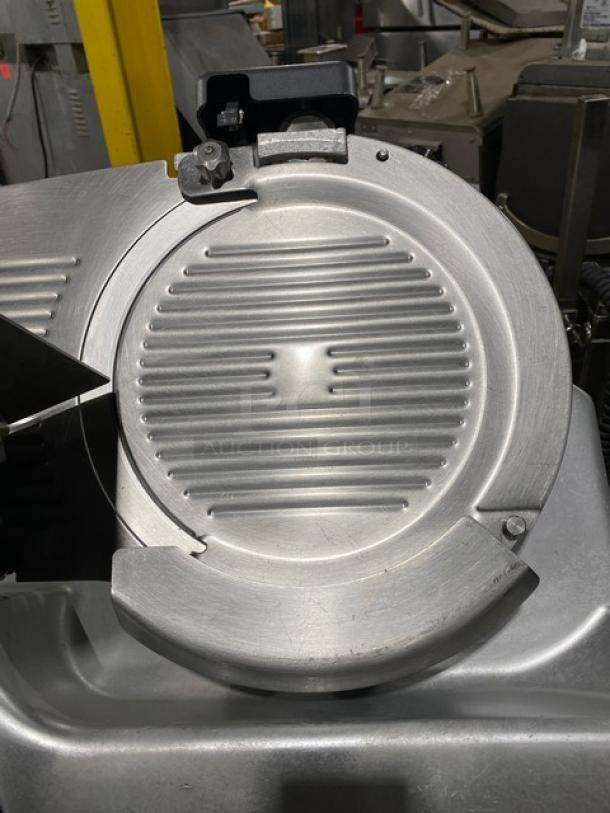 Hobart 2912 commercial stainless steel electric meat slicer on new stand, 120V, excellent condition.