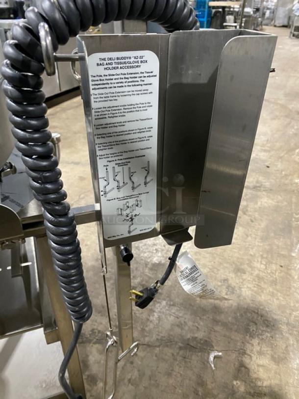 Hobart Model 2912 electric meat slicer on a new stand, with stainless steel body, 120V, 1 Phase, visible instructions on holder.