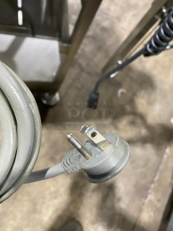 Hobart 2912 commercial meat slicer, stainless steel, electric-powered, on new slicer stand, 120V, single phase.