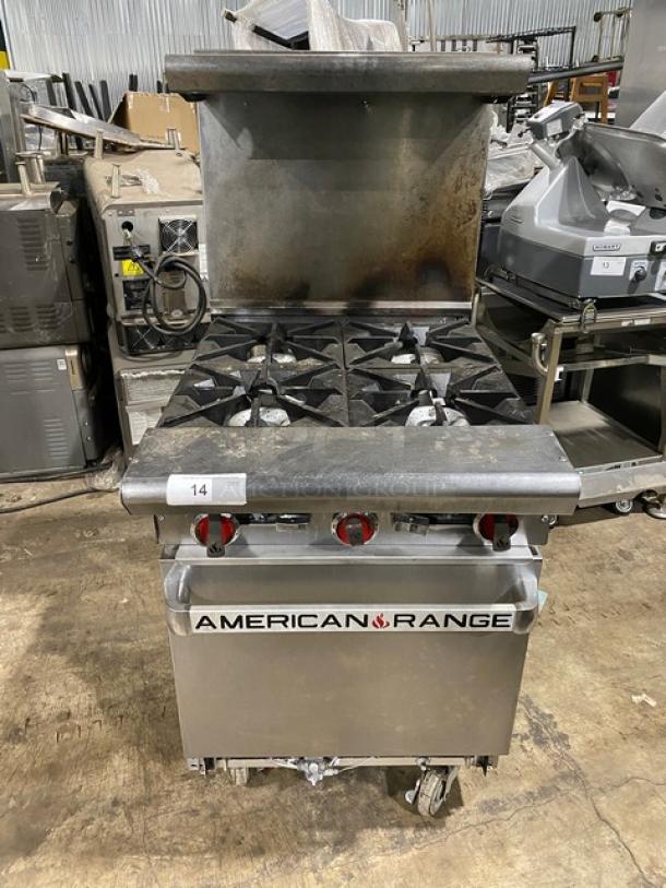 American Range stainless steel 4-burner gas range with oven, backsplash, salamander shelf, wired rack, on casters.