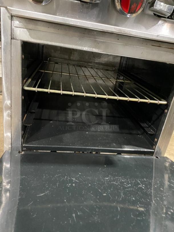 American Range commercial stainless steel 4-burner range/oven combo features a backsplash, salamander shelf, and wired oven rack.