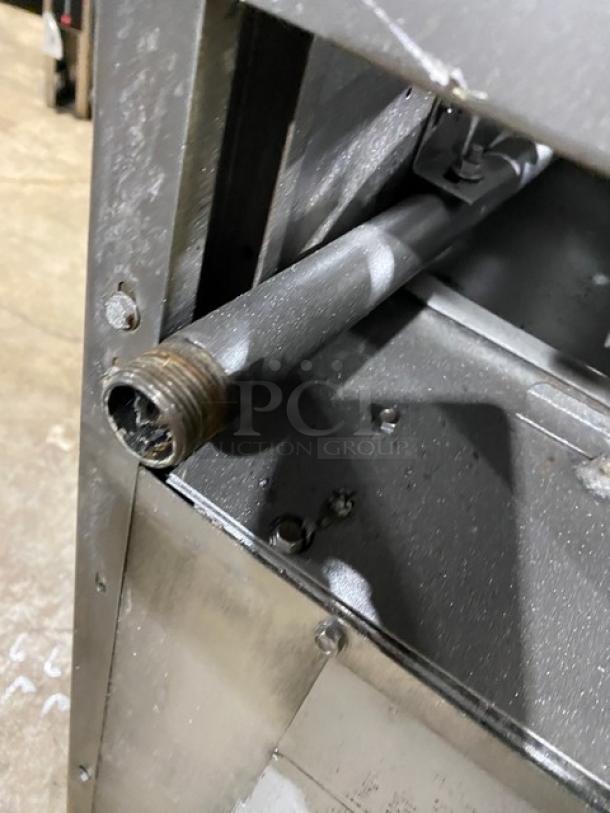 American Range commercial stainless steel 4-burner range/oven combo with backsplash, salamander shelf, wired rack, and casters.