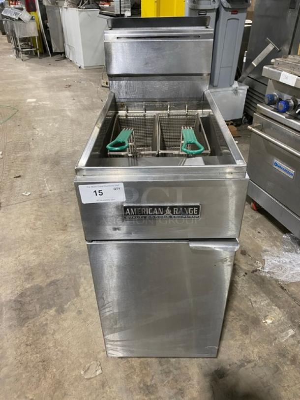 American Range stainless steel natural gas deep fat fryer with back splash, basket hanger, and fry basket; on legs; used condition.