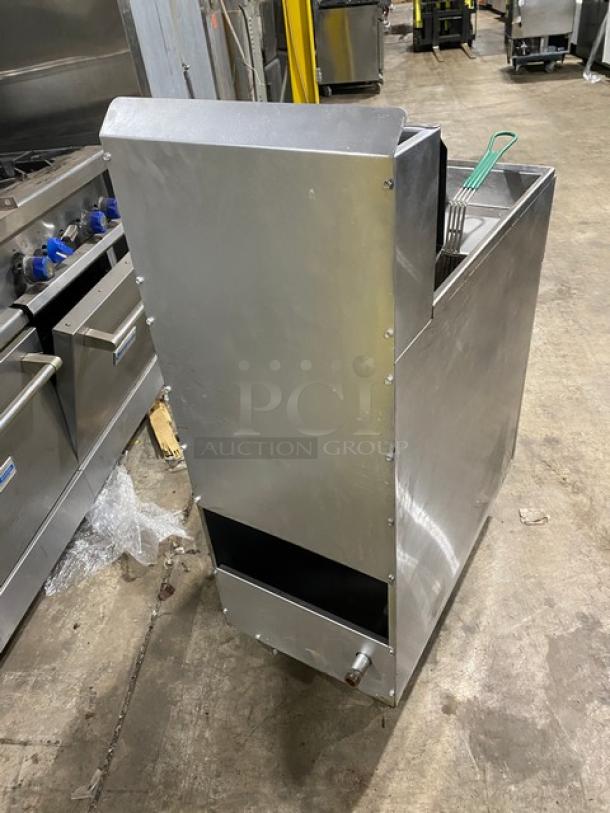 American Range stainless steel deep fat fryer with back splash and basket hanger. Includes fry basket. On legs.