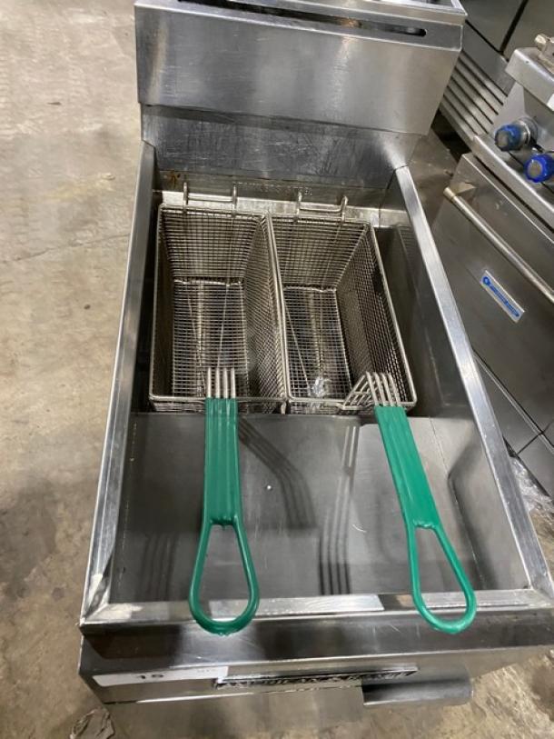 American Range commercial stainless steel deep fat fryer, natural gas powered, with backsplash, basket hanger, and fry baskets.