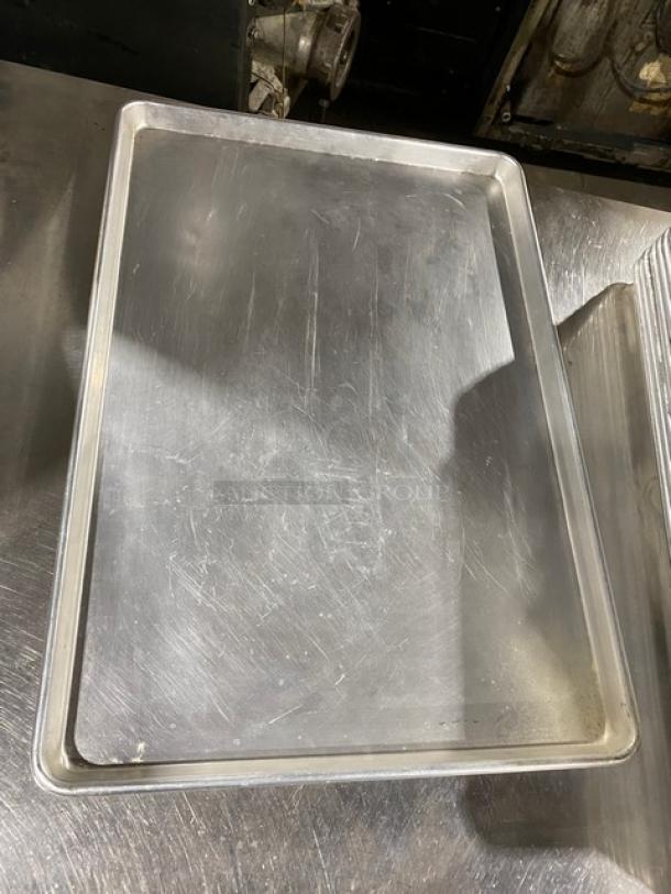 Commercial stainless steel fast food serving tray, used condition. Rectangular shape with raised edges, durable design.