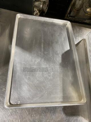Commercial stainless steel serving tray, rectangular, gently used, with light surface scratches, durable for fast food use.