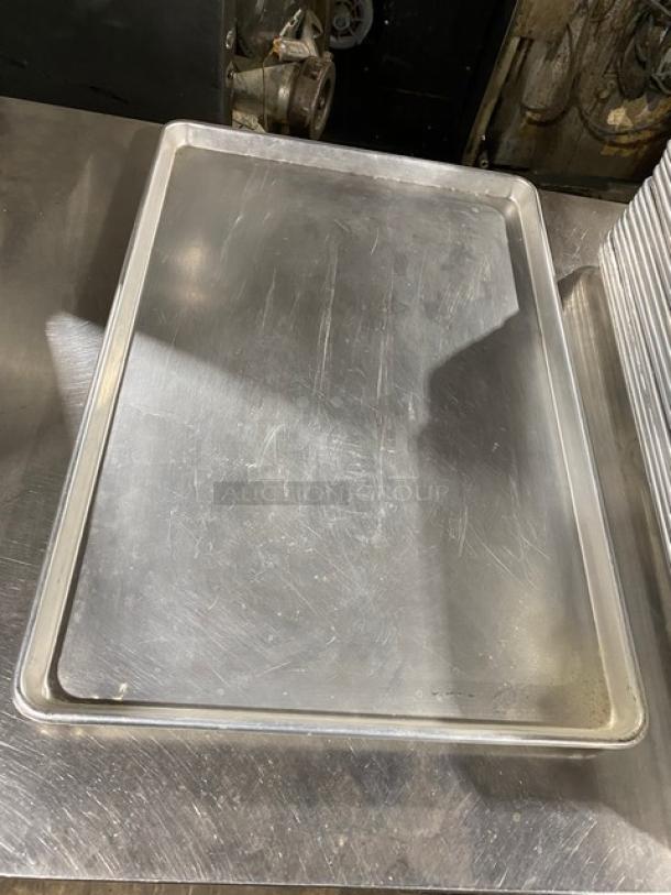Commercial stainless steel serving tray, rectangular, well-used with visible scratches, durable, ideal for fast food settings.