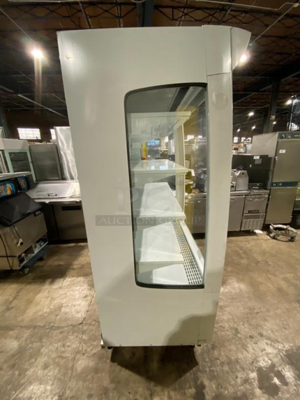 Beverage Air MB13US commercial white refrigerated 5-tier open display case. Well-maintained, model SN: 82300210, 115V 1Phase.