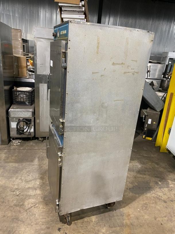 Alto-Shaam Model 1000-41P commercial cook and hold oven, stainless steel, full-height, 2-solid half doors, on casters.