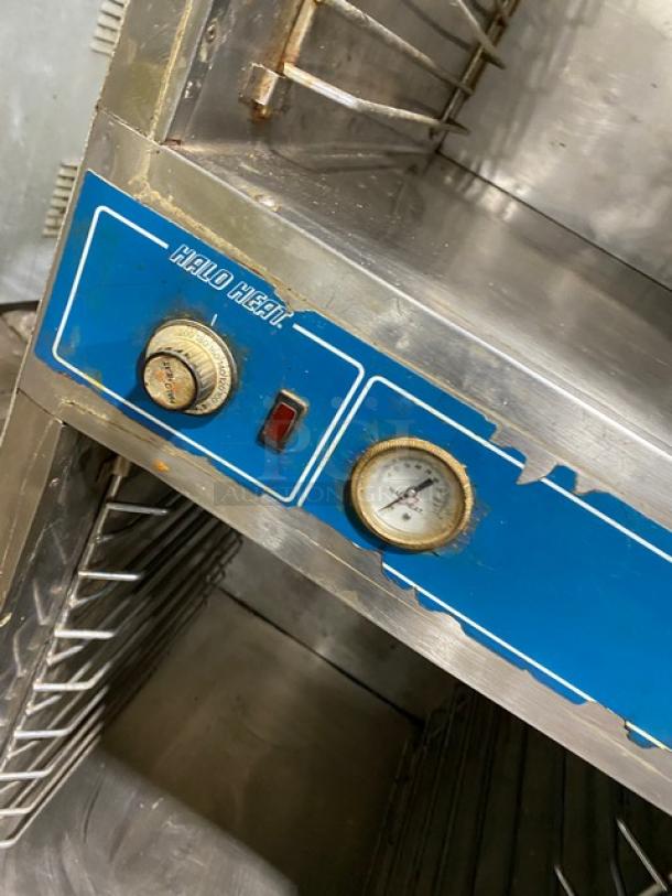 Alto-Shaam Model 1000-41P stainless steel cook & hold oven, with dials and built-in pan slides, 125V, on casters.
