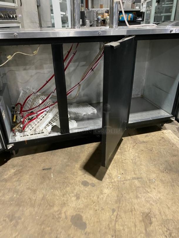 Micro Matic MDD-78 black 3-door kegerator with open compartments, 2 double-tap tower dispensers, on casters, model SN: 14090939M.