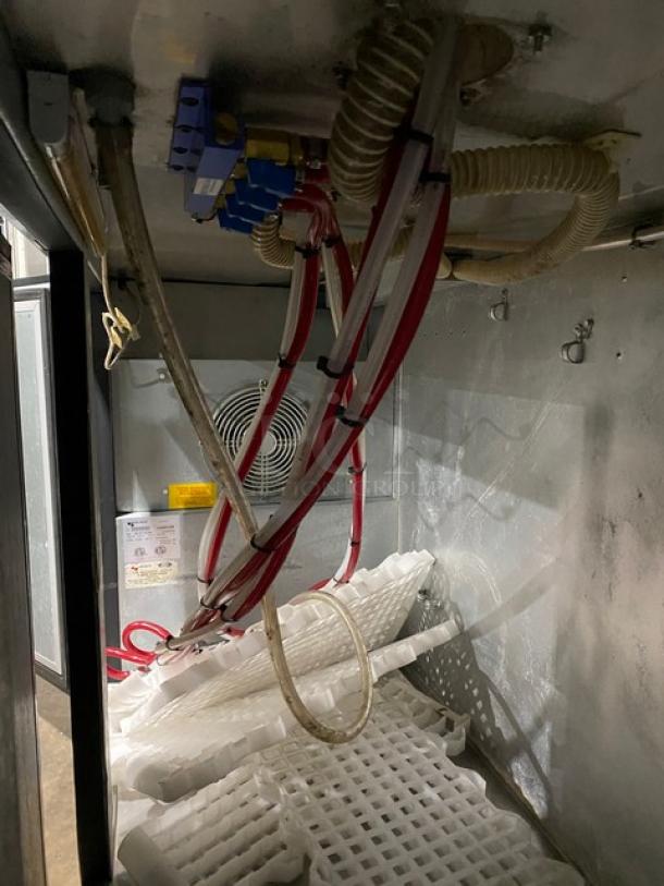 Micro Matic MDD78 3-door kegerator interior view, showing cooling components and dispensing lines. 115V, on casters.