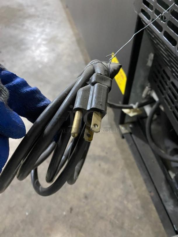 Micro Matic MDD-78 kegerator power cord close-up. Black, 115V 1 Phase, standard plug, mainly showing cord condition.