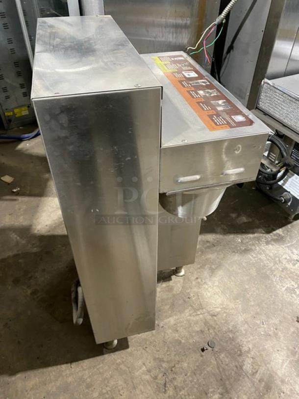 Fetco CBS2052 commercial stainless steel coffee machine, electric-powered, on legs. Model CBS-2052 SN: 370110030930B.