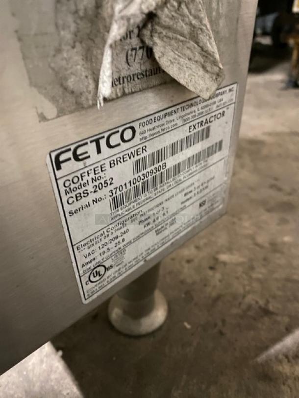Fetco CBS-2052 stainless steel coffee machine, model CBS-2052, serial 370110030930B, electric powered, on legs.