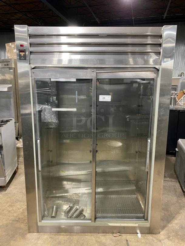Traulsen commercial double sliding glass door refrigerator, model RHT232NREFSL, with wired racks, on legs, 115V 1 phase.