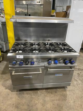 American Range stainless steel 8-burner range with double oven, backsplash, overhead salamander shelf, and casters. Natural gas powered.
