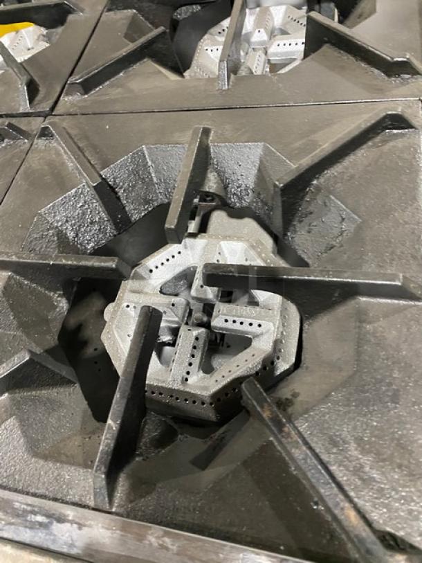 American Range commercial 8-burner natural gas range, stainless steel, double oven combo, with casters, backsplash, and salamander shelf.