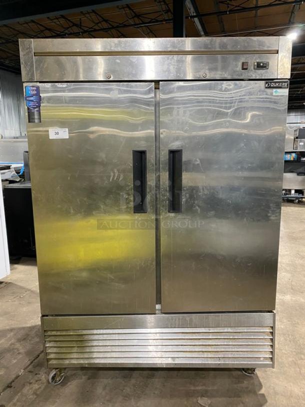 Duker's D55F commercial stainless steel 2-door reach-in freezer with poly-coated wired rack, on casters, 115V, SN: 1098000DUK200803200900777.