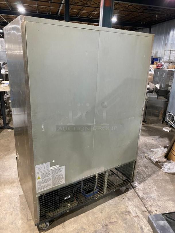 Duker's D55F commercial stainless steel 2-door reach-in freezer, poly coated wired rack, 115V, on casters, SN: 1098000DUK200803200900777.