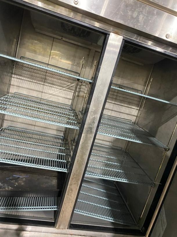 Duker's D55F commercial stainless steel 2-door reach-in freezer, poly-coated wired racks, on casters, 115V, Model SN: 1098000DUK200803200900777.