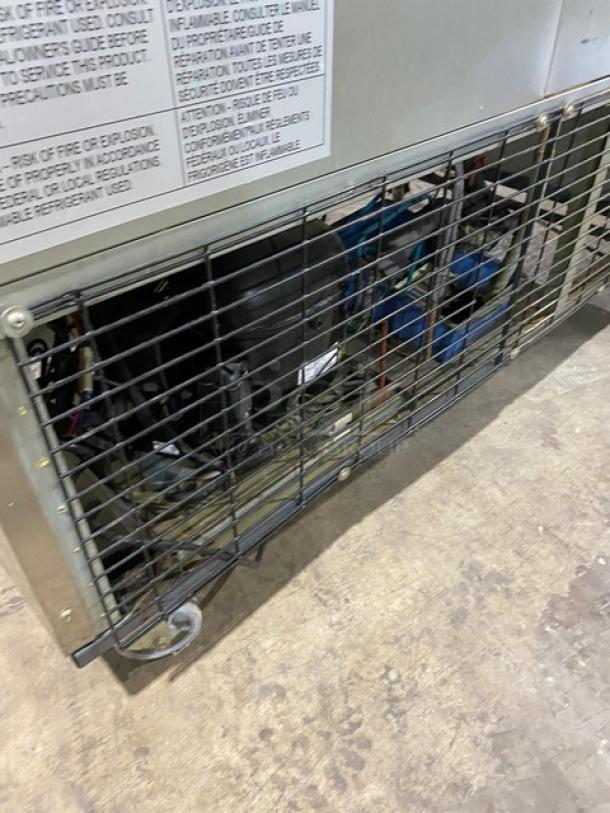 Duker's D55F commercial freezer, stainless steel, solid 2-door with poly-coated rack, on casters, model label visible.