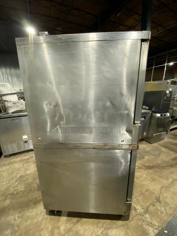 Blodgett commercial stainless steel gas double convection oven on casters, thermostatic controls, wired oven rack, used condition.