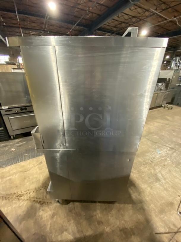 Blodgett stainless steel double stacked convection oven on casters; gas powered with thermostatic controls and wired rack.